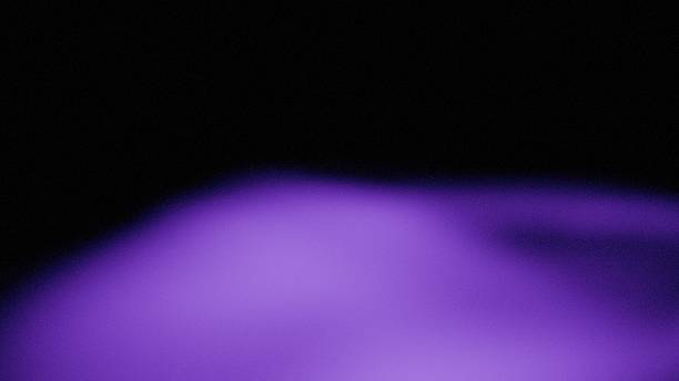 istock an image cover header design of a textured gradient light glow of light purple on a dark background 2243320863