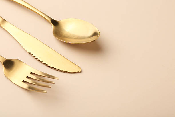 istock Stylish cutlery set on beige table, space for text 2243324769
