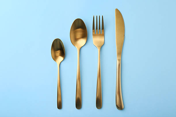 istock Stylish cutlery set on light blue table, flat lay 2243324810