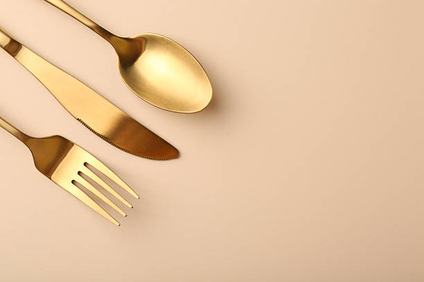istock Stylish cutlery set on beige table, flat lay. Space for text 2243324819
