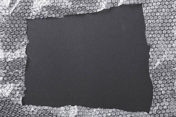 istock Frame made of bubble pack on black background, top view. Space for text 2243327230