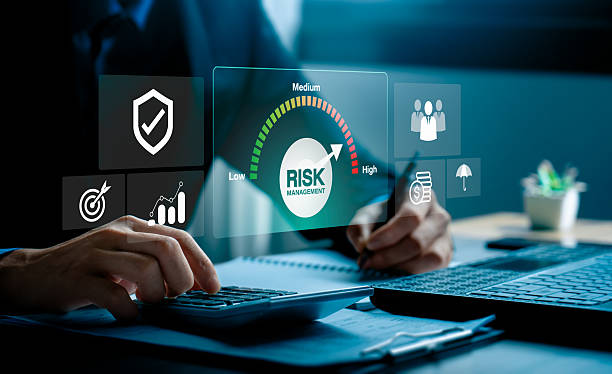 istock Risk management and financial strategy concept with businessman analyzing investment data and protecting assets, using calculator, digital dashboard to evaluate low, medium, high business risk levels 2243329842