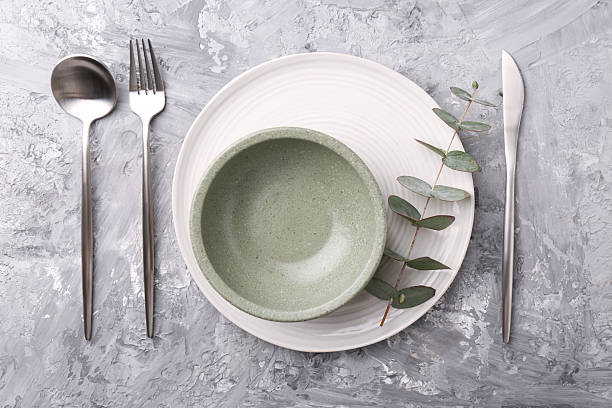 istock Elegant setting with silver cutlery on grey textured table, flat lay 2243329868