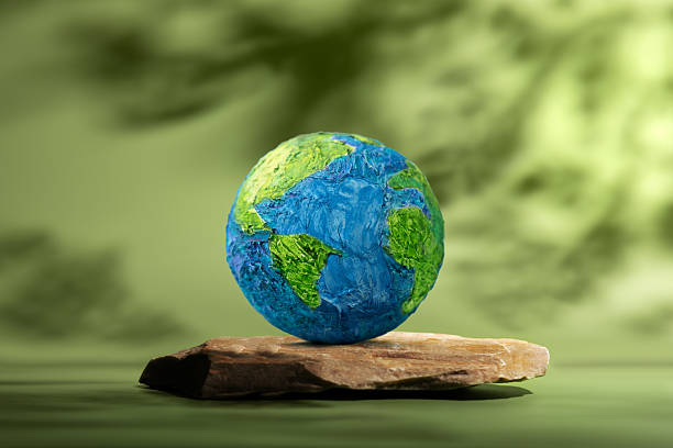 istock Earth Day. Globe on Natural Rock represting Green Environment, Sustainable Business 2243336733