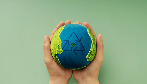 istock Earth in hands symbolizing sustainability, Recyling and Renewable 2243336747