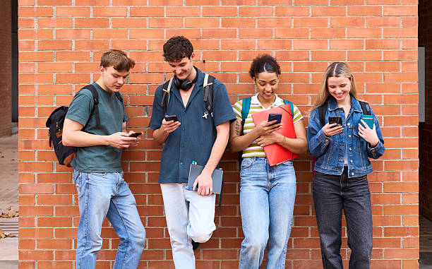 istock Group of diverse gen z students using smartphones 2243337799