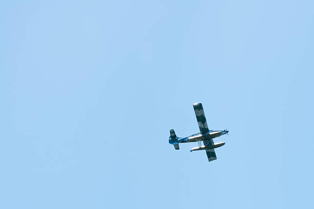 istock Monoplane flying through the sky as seen from below 2243339654