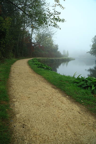istock River footpath early morning fog 2243342270