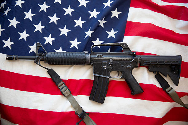 istock m 16 rifle and USA flag 2243344847