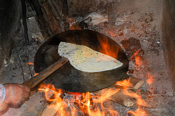 istock Baking flatbread on an iron sheet on the tandoor 2243346094