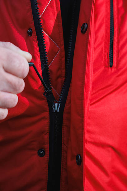 istock person accesses gear through zipper, technician reveals inner compartment by unzipping outer layer 2243352387