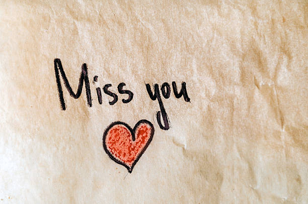 istock Miss you note on crumpled paper 2243352477