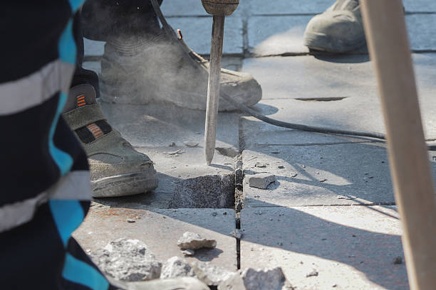 istock Pavement broken by jackhammer in city 2243353265