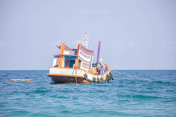 A fishing boat against the sea view background