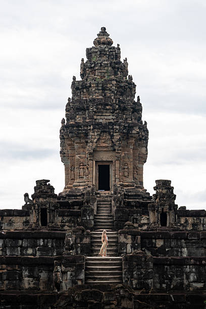 istock Woman exploring ancient angkor wat temple in cambodia 2243359590
