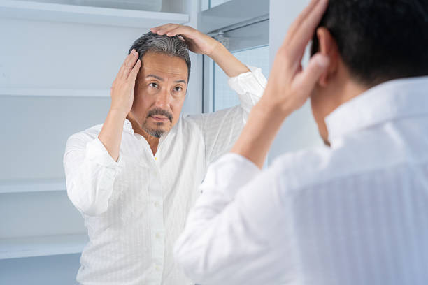 istock senior man doing beauty care in the bathroom 2243359997