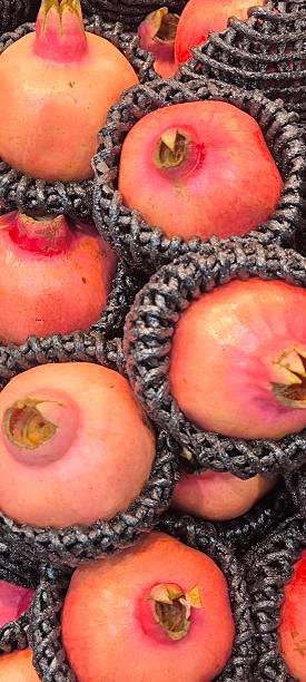 istock Red pomegranates in a fruit shop 2243360459