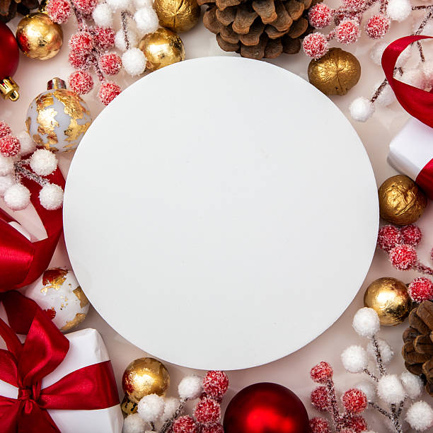 istock Empty round mockup in a Christmas composition with baubles, pinecones and berries. Space for logo, text or holiday message. 2243361495