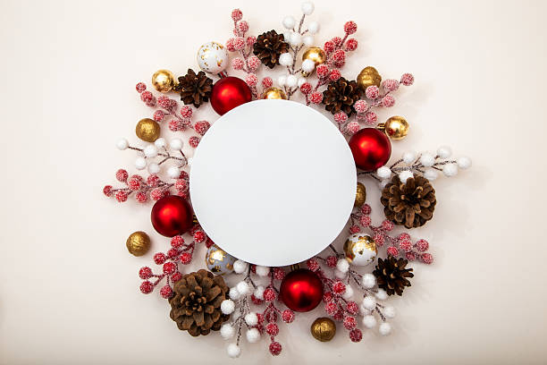 istock Empty round mockup in a Christmas composition with baubles, pinecones and berries. Space for logo, text or holiday message. 2243361501