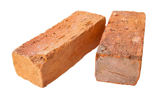 istock Side view of two cracked old red or orange bricks in stack isolated on white background with clipping path 2243361754