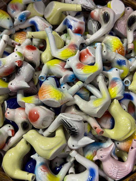 istock Colorful ceramic bird whistles close up. Handicraft texture 2243361959