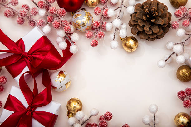 istock Christmas composition with gifts, pine cones and baubles on white background. Minimalist festive backdrop with copy space. 2243362048