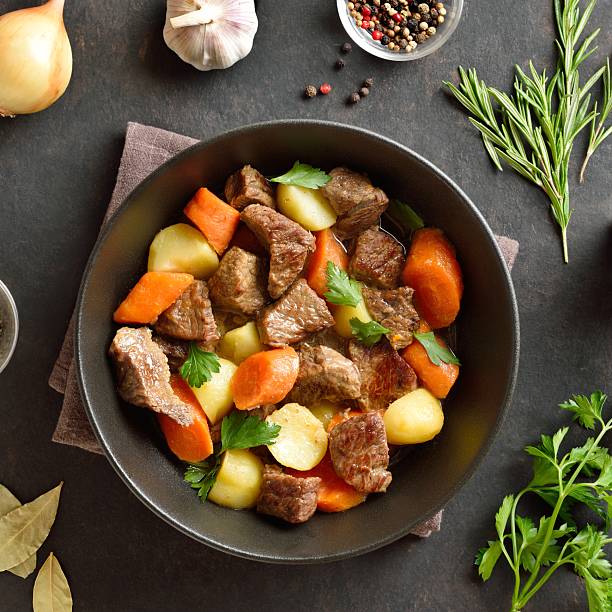 istock Beef stew with potatoes, carrots and greens 2243363764