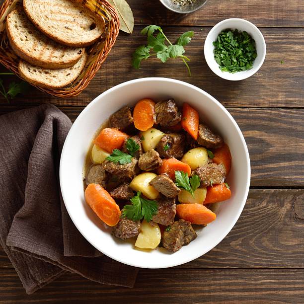 istock Beef meat stewed with potatoes, carrots and spices 2243363780