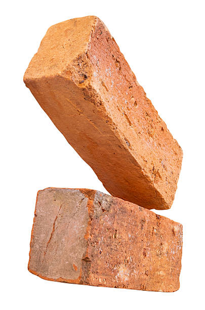 istock Side view of two cracked old red or orange bricks in stack isolated on white background with clipping path 2243364859