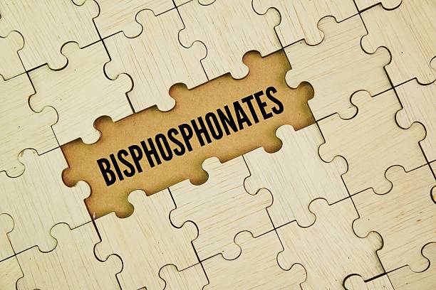 istock Wooden puzzle with the word bisphosphonate. 2243365074