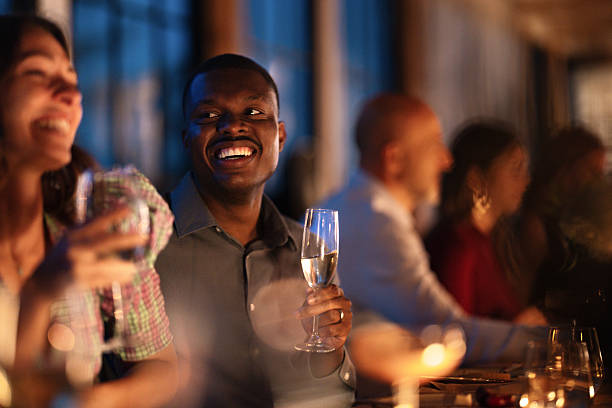 istock Joyful Friends Dinner Celebration With Champagne Glasses At Evening Event 2243366766