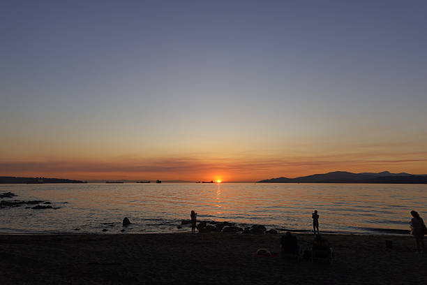 istock Brilliant sun dipping behind distant mountains 2243369425