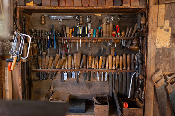 istock Carpentry tools wall with chisels files screwdrivers planes organized on shelf 2243369482