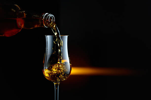 istock Bourbon being poured into a glass. 2243370843