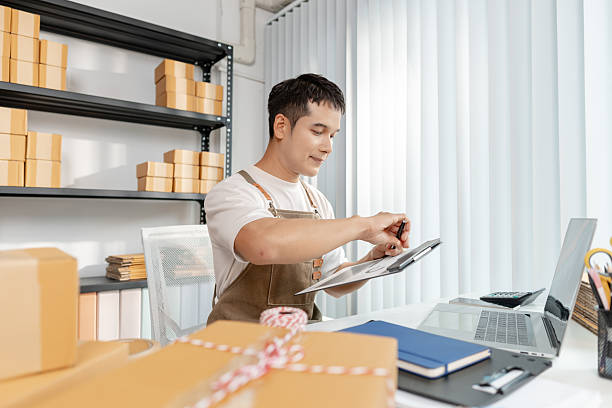 istock Young entrepreneur managing online business, preparing packages and working with e commerce operations, representing digital marketplace, startup growth and modern retail strategy. 2243372680