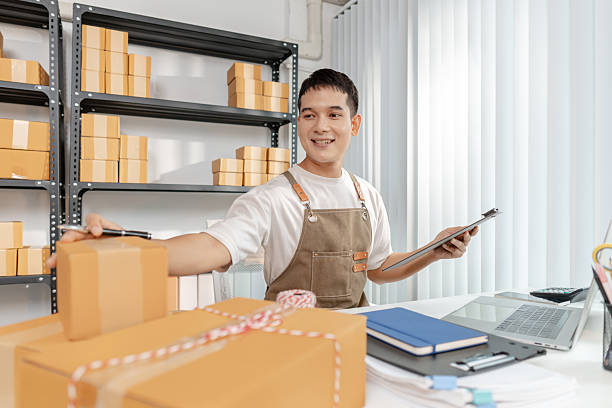 istock Young entrepreneur managing online business, preparing packages and working with e commerce operations, representing digital marketplace, startup growth and modern retail strategy. 2243372746
