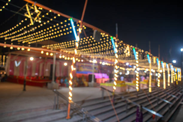 Festive Bokeh: Warm Yellow and Purple Lights at Night Event
