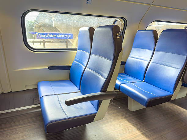 istock Interior of Dutch train with empty seats at Amsterdam Sloterdijk station 2243375745