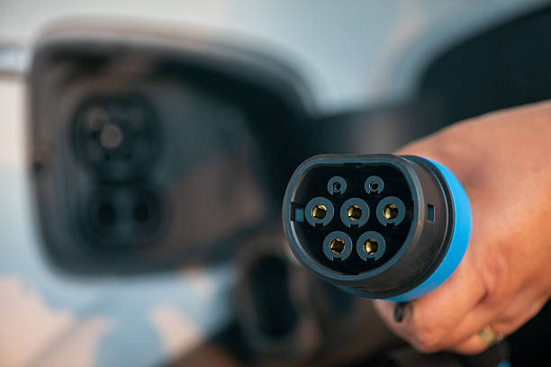 istock Electric Vehicle Charging Plug Close-Up. 2243377644