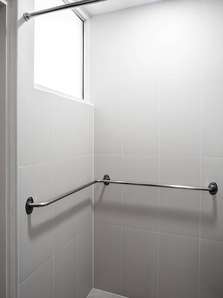 istock Stainless steel grab bar installed in bathroom for elderly or disabled safety support in hospital. Concept of accessible bathroom, injury prevention, patient care, and home safety modification design. 2243378203