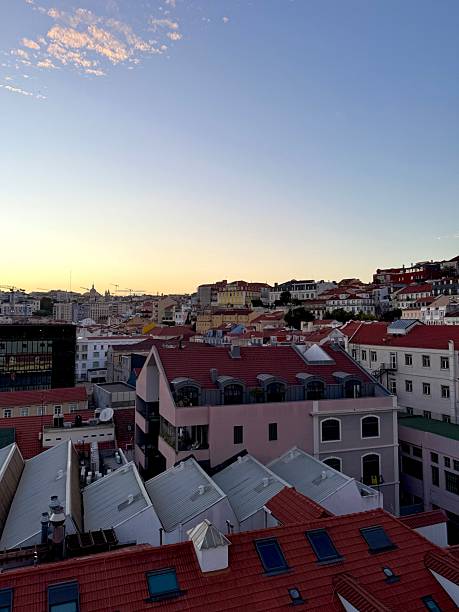 istock Lisbon city skyline at sunset with red rooftops 2243378725