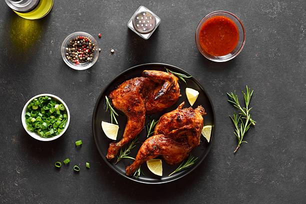 istock Barbecued half chicken with lemon and rosemary 2243378937