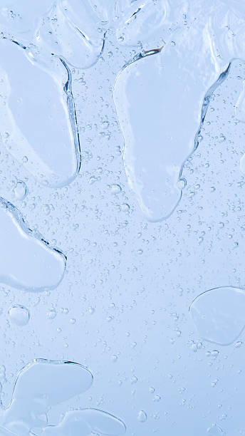 istock Fresh hydration concept: small bubbles in liquid on a blue background, 9:16. 2243379003