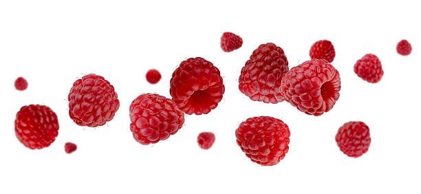 istock Beautifully retouched raspberries fly and levitate in space. Isolated on white. 2243380561