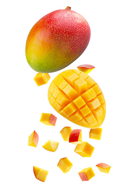 istock Whole  mango, large slice of mango in turn cut into square pieces and individual cubic and triangular pieces fall in space. Isolated on white 2243380562