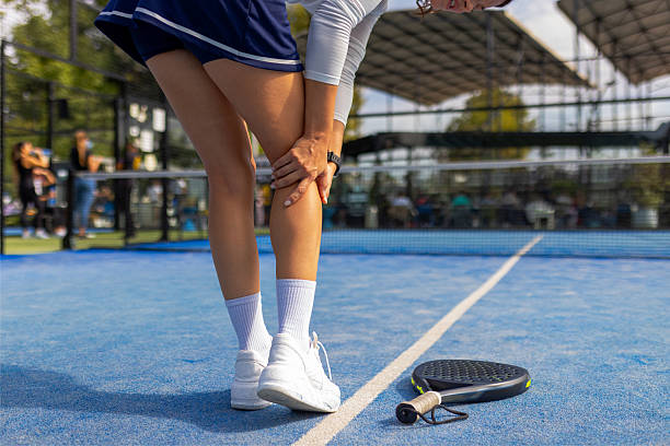 istock Sports Injury: Woman Suffering Calf Pain While Playing Padel 2243380740