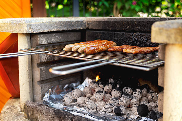 istock sausages and steaks are cooked on the grate on an old rustic gril 2243382753
