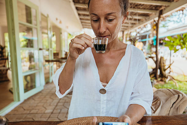 Woman Enjoying Espresso at Outdoor Cafe