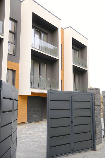 istock A building exterior features balconies and a large dark gate 2243387797