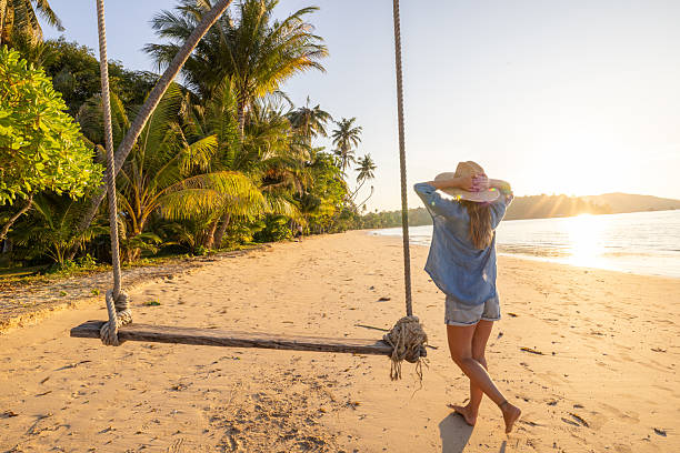 istock Woman Walking on Tropical Beach at Sunset 2243387907